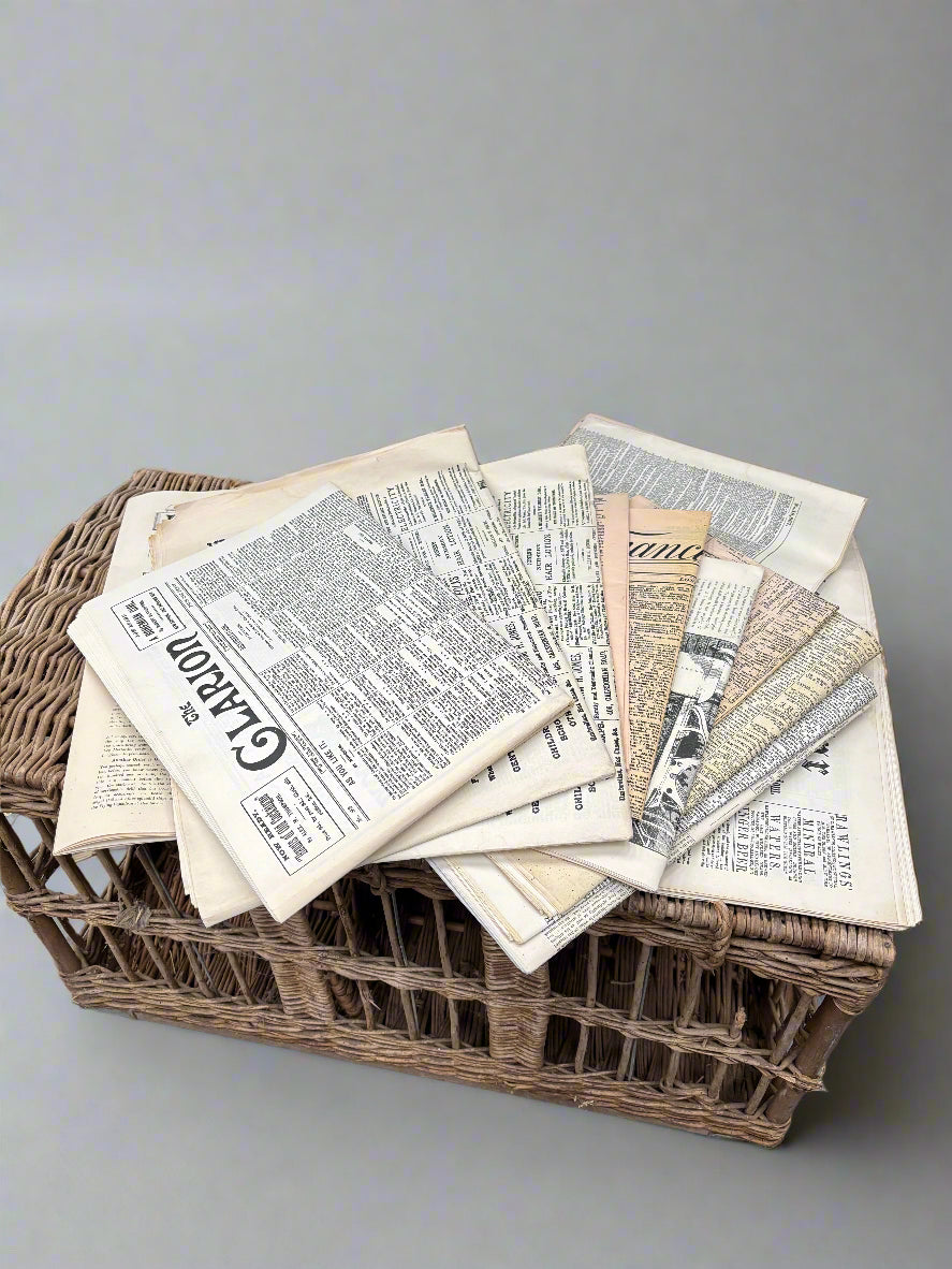 A selection of period 'graphic prop-make' newspapers.