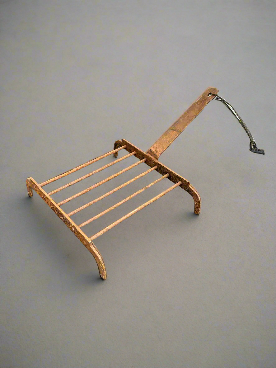Small grid fireplace iron forge/ cooking grate in an aged condition.