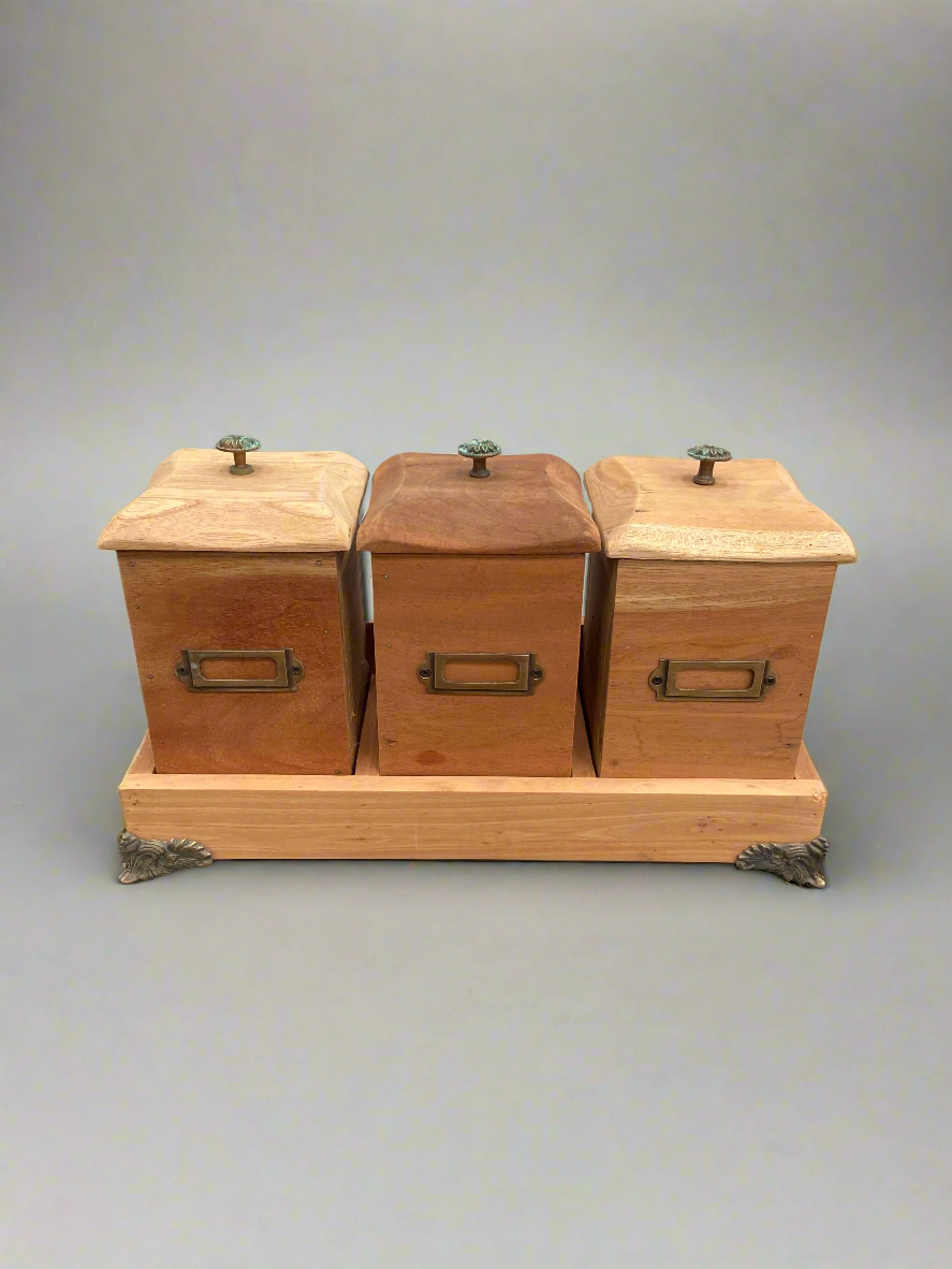 Vintage wooden kitchen canisters set, the type to store tea, coffee and sugar.