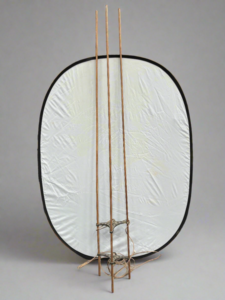 A Victorian hanging clothes airer with three laths, crafted from wood and iron.