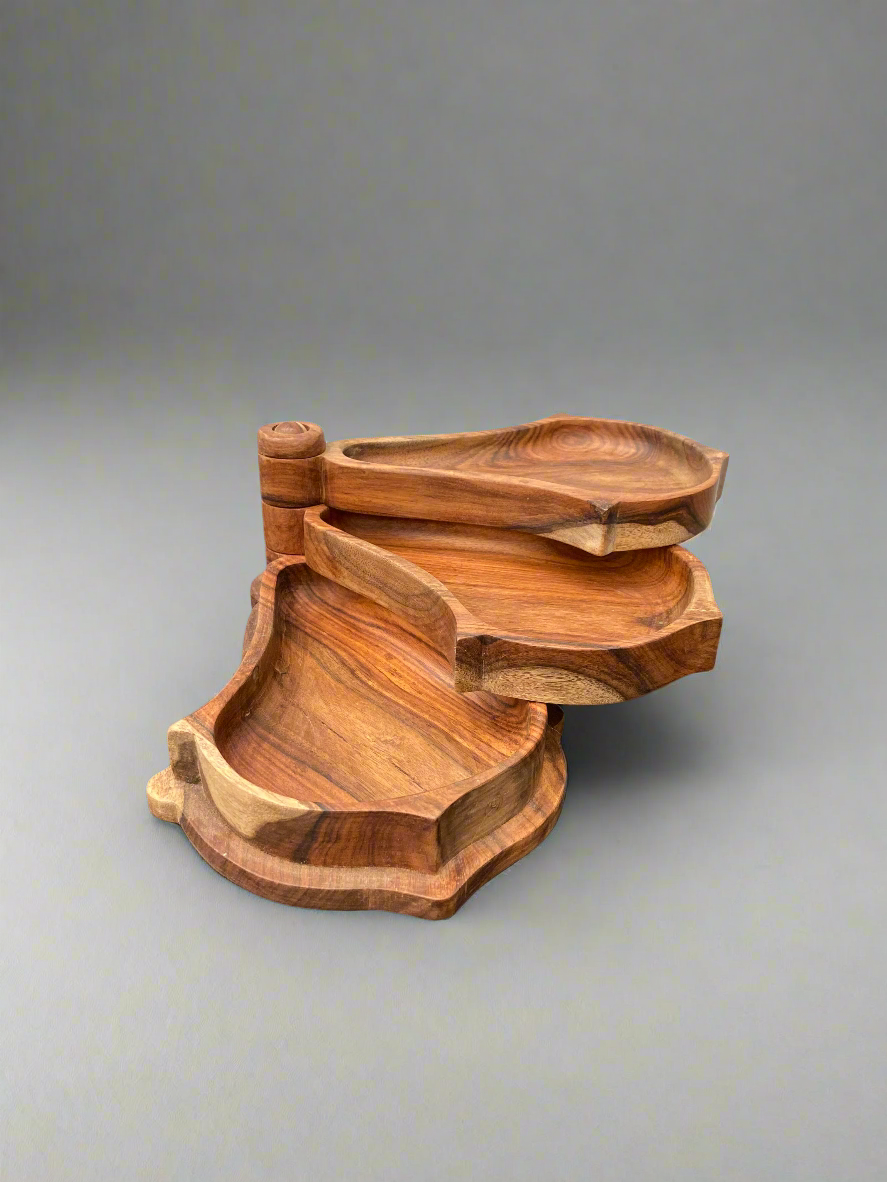 Teak wooden swivel stacking dishes/ aperitif trays, made in Egypt. Designed for displaying snacks and nibbles.