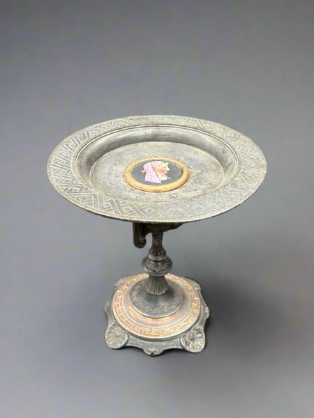 Vintage tazza fruit plate on a tall, ornate metal stand. Circa 1960s and featuring an Egyptian head.