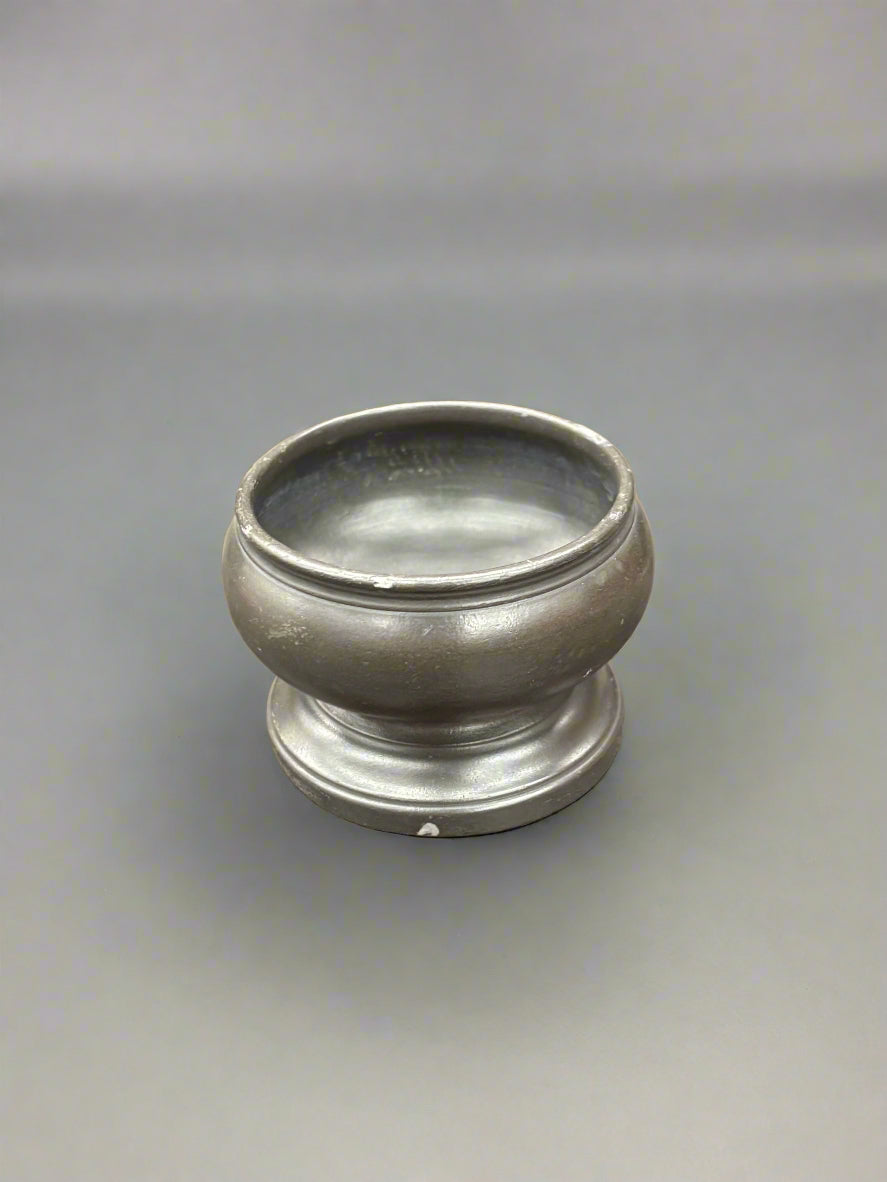 A small pewter salt bowl. It could be Georgian, circa 18th century.