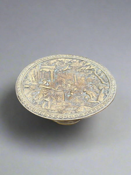 An antique brass tazza fruit plate depicting a Grecian scene, circa 19th century.