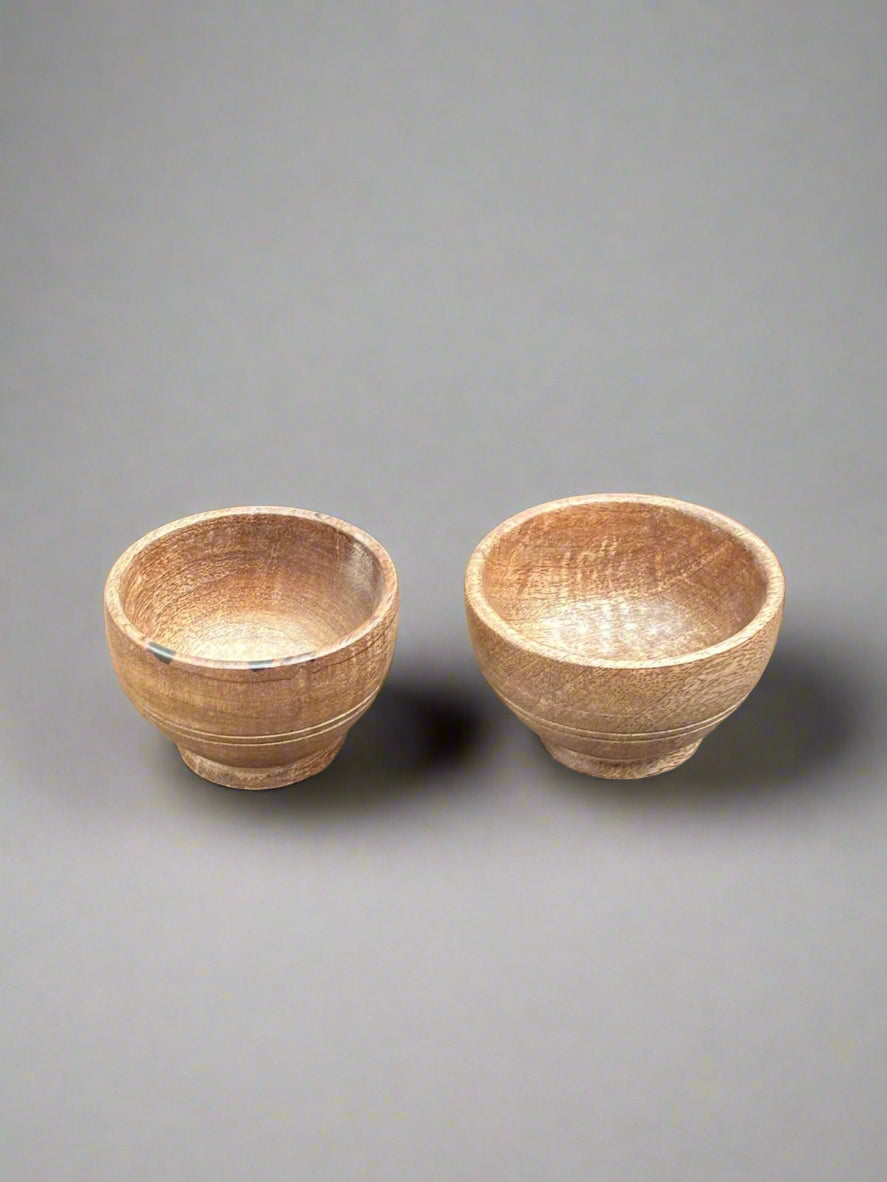 A matching pair of small, Japanese-style, wooden rice bowls.