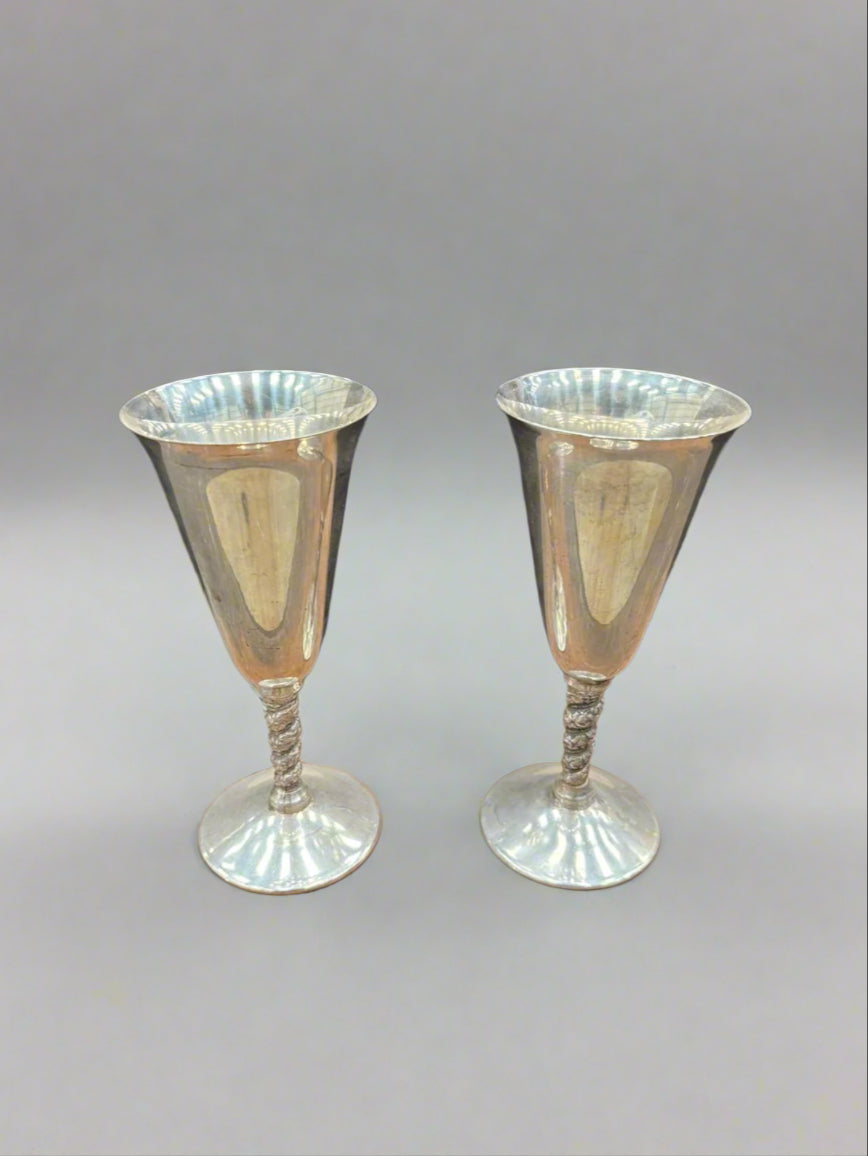 A pair of vintage Spanish silver plated wine goblets with twisted stems.