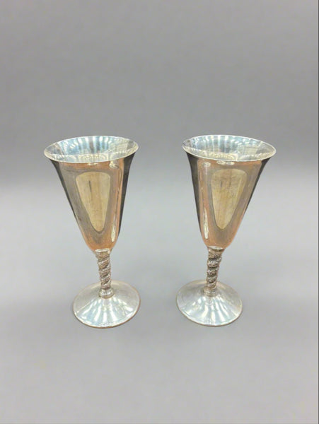 A pair of vintage Spanish silver plated wine goblets with twisted stems.