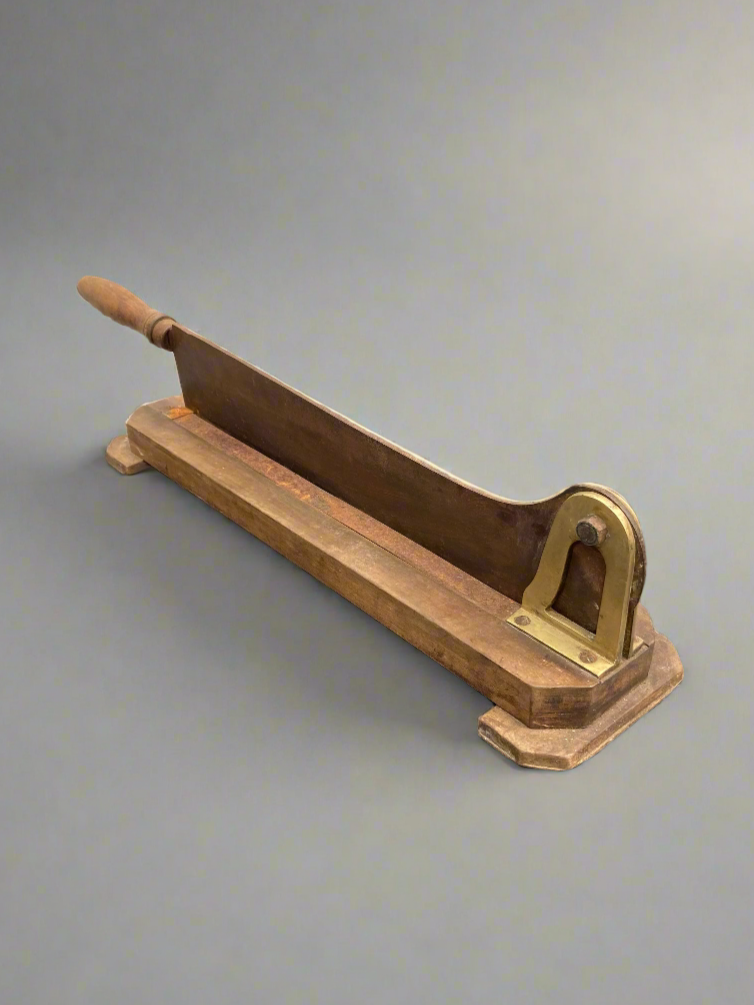 Antique guillotine-style bread and baguette cutter, circa 19th century.