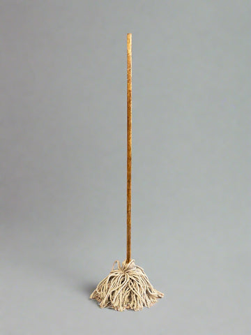 A matching set of traditional floppy cotton mops with wooden handles.