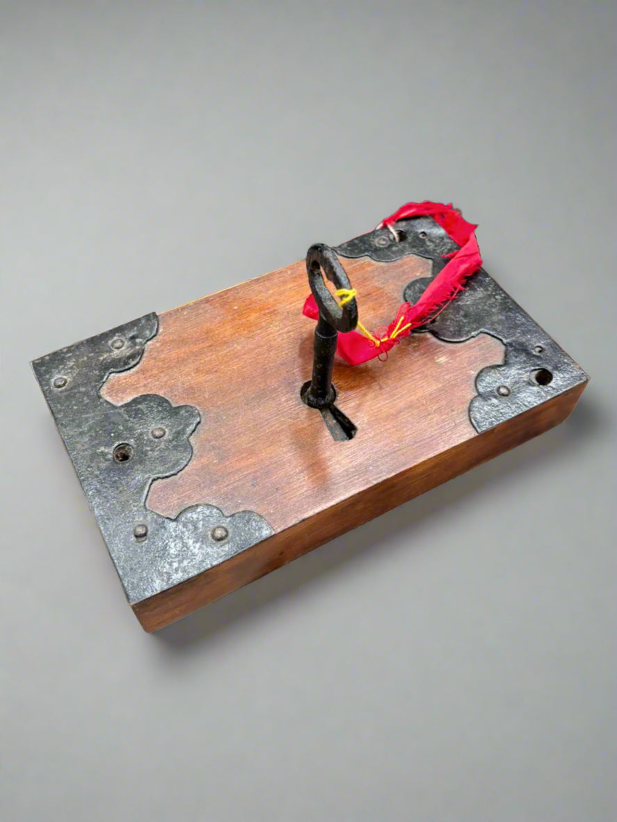 Antique, gothic-style, rim lock furniture with a cast iron border and key.