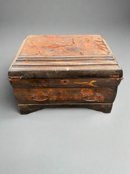 A detailed Japanese-style haberdashery chest with a sectioned and lacquered interior.