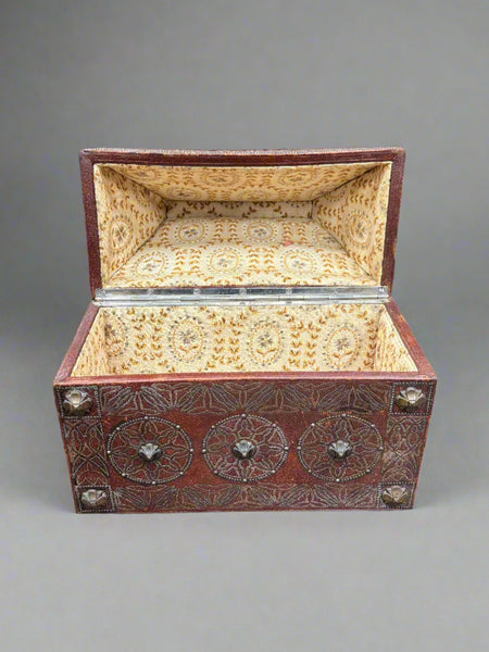 A studded manuscript storage box, could be Burmese. Lined with a yellow patterned fabric lining.