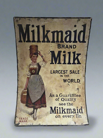 A reprint of an original antique enamel print from 1880 advertising milkmaid brand milk.