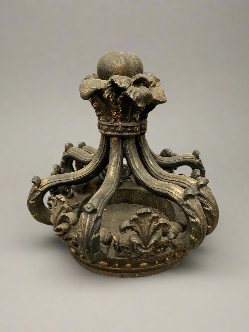 A large antique regal stone statue shaped like a crown with ornate carvings. This is an original heavy piece, not a lightweight prop make.