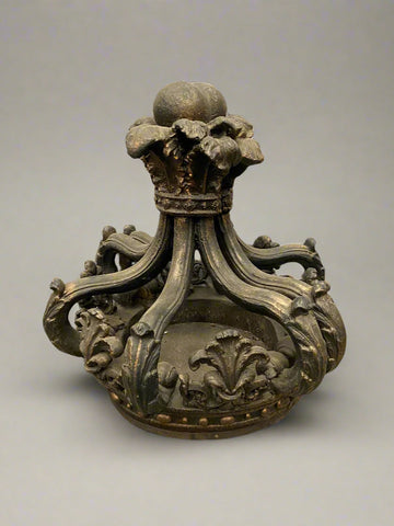 A large antique regal stone statue shaped like a crown with ornate carvings. This is an original heavy piece, not a lightweight prop make.