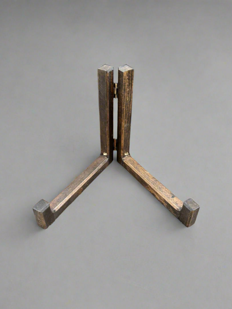 A large set of wooden display stands, for displaying books, plaques, records, signs or plates.