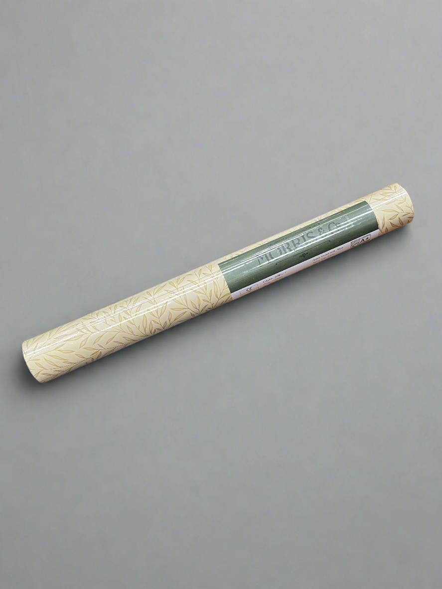 A new roll of Morris & Co lily leaf wallpaper.