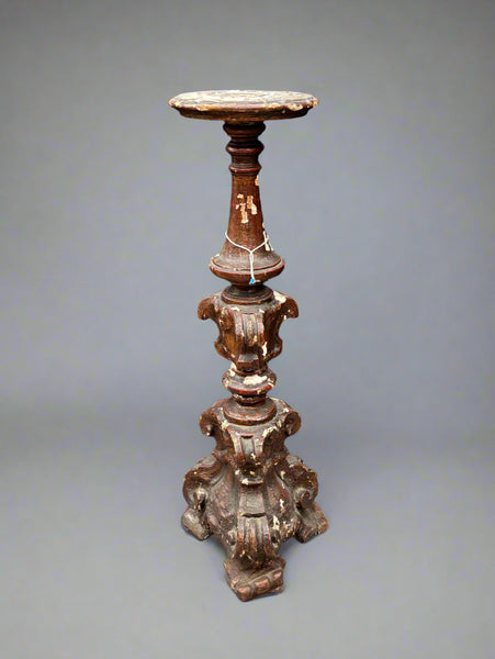 A matching pair of Italian Neoclassical candle stands/ altar sticks, carved in a baroque style.