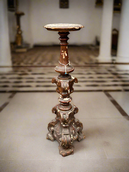A matching pair of Italian Neoclassical candle stands/ altar sticks, carved in a baroque style.