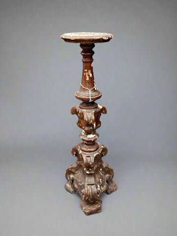 A matching pair of Italian Neoclassical candle stands/ altar sticks, carved in a baroque style.