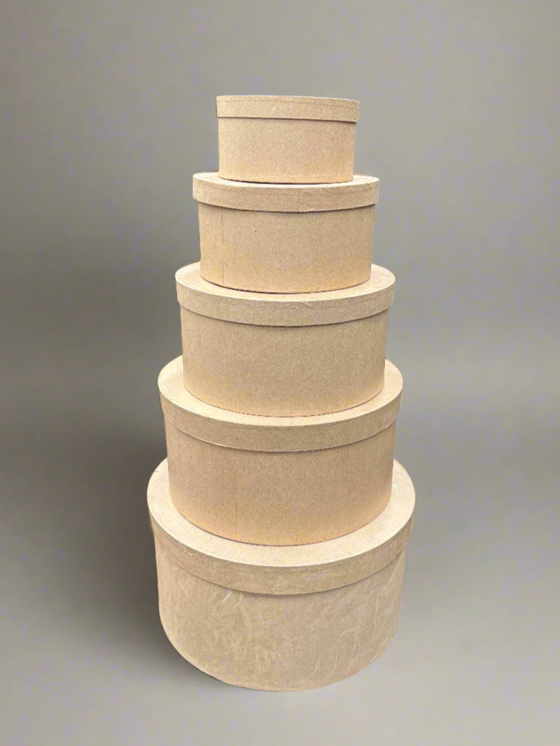A matching set of round cardboard nesting hat/gift boxes.