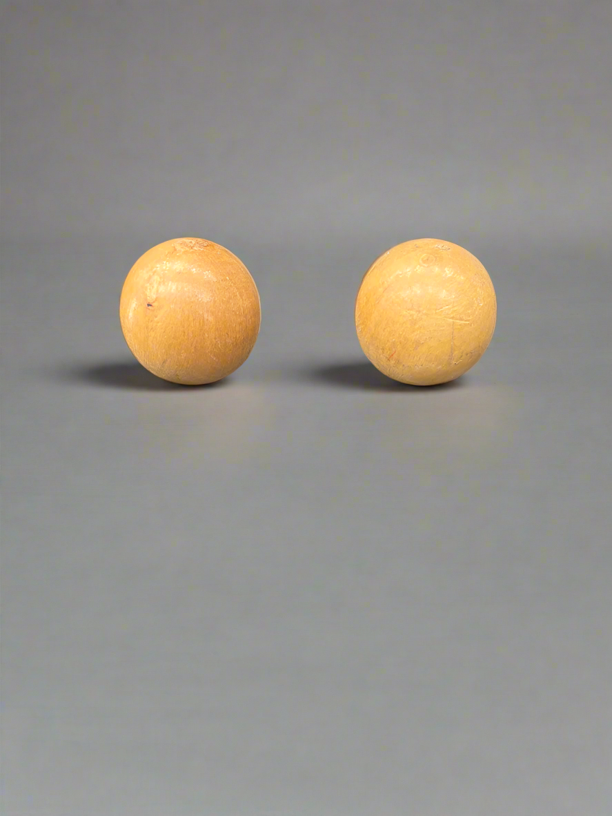 A pair of vintage wooden billiard/ skittle balls.