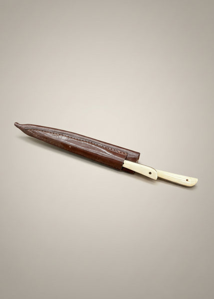 A letter opening set (a knife and pricker or spike) in a leather sheaf.