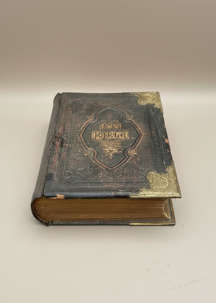 A large antique leather bound Holy bible with reinforced brass corners, circa 1900s.