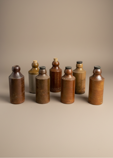 A set of period salt glazed stoneware beer bottles, circa 19th century.