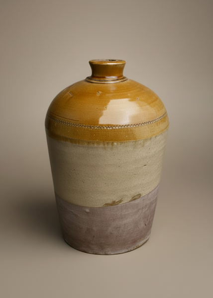 A large stoneware flagon jug, showcasing three different tones and textures.