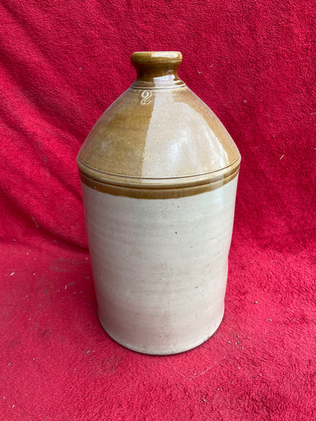 A trio of antique salt glazed stoneware flagons, in an aged condition.