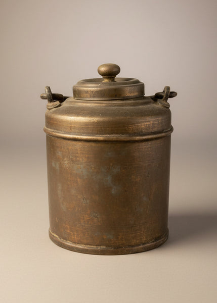 A set of vintage Indian brass milk pots/ bharnis, with a ridged textured finish.