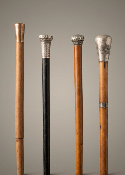 A collection of officer's wooden swagger sticks/ walking canes with silver mounts.
