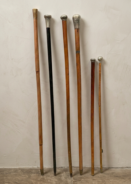 A collection of officer's wooden swagger sticks/ walking canes with silver mounts.