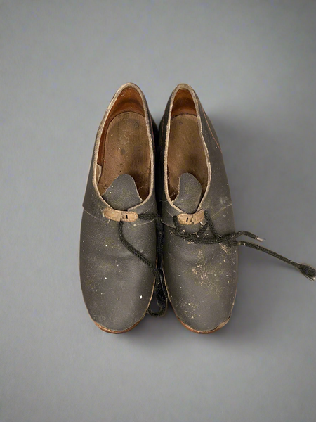 A Collection of Aged Wooden Clogs