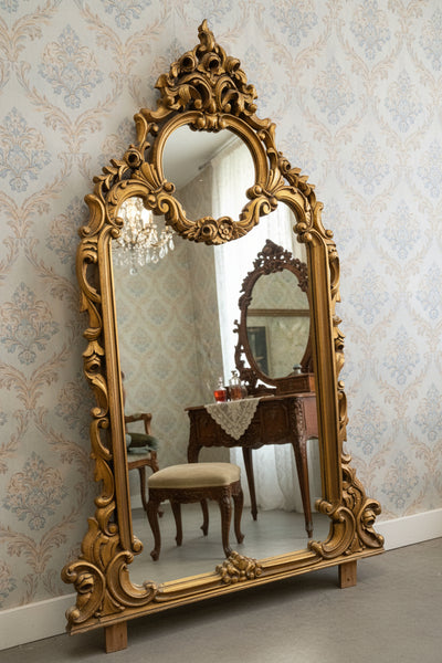 A grand, antique, French, baroque-style, gilt wood mirror, circa 19th century.