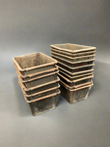 A set of large rectangular unbranded loaf tins.