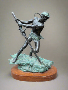 1930s Art Deco statue of a lunging male figure, sized for adorning a mantlepiece.