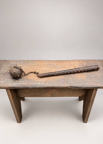 A medieval horseman spiked ball and chain flail weapon.