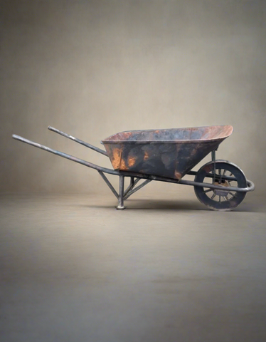 A set of rusty metal black wheelbarrows.