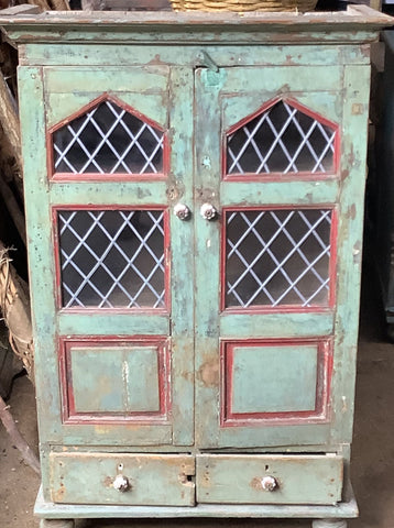 French style antique cabinet, painted red and sea green with latticed windows.