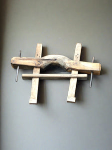 Wooden yoke, used for plowing fields. Typically 2 animals, normally oxen, would be hooked up to it to pull a plow.