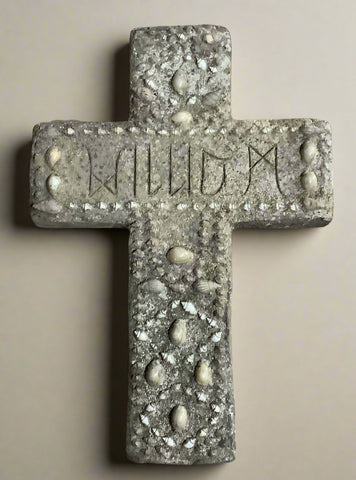 Stone grave marker, decorated with shells.