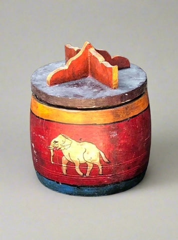 Aged red hand-painted storage pot with an elephant design.