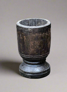 Wooden hand-carved chalice goblet with a thick stem and dark stain.