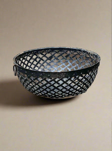 Black metal mesh storage/fruit bowl with ring handles and studded rim.  Medieval style design.