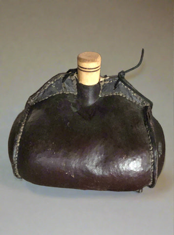 Hand crafted drinks pouch with wooden stopper.  Medieval style design; a portable receptacle for wine.