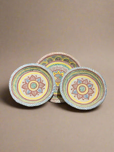 Three hand-painted Mexican style paper māché plates.