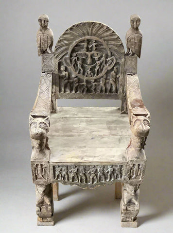 Ceremony-style carved wooden seat with Aztec and Egyptian symbolic features.