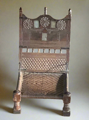 Indian prayer kneeling pida stool, with a woven charpoy style seat. Late 19th to mid 20th century. Wooden frame with carved detailing.